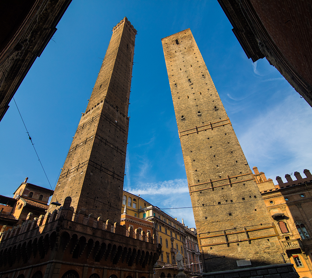 Two famous falling towers Asinelli and Garisenda in the morning, Bologna, Emilia-Romagna, Italy